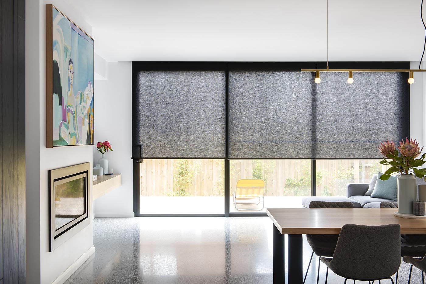 Light-filtering roller blinds allowing soft natural light into a living room