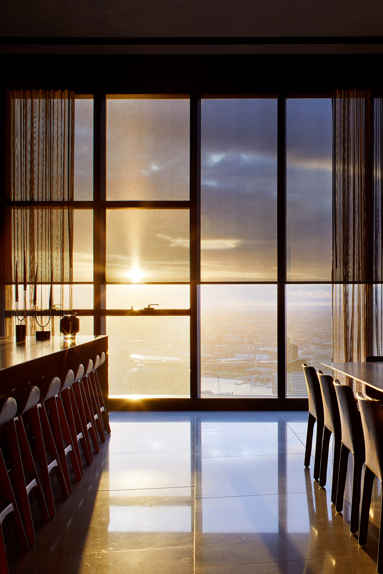 Custom roller blinds in a modern living room.